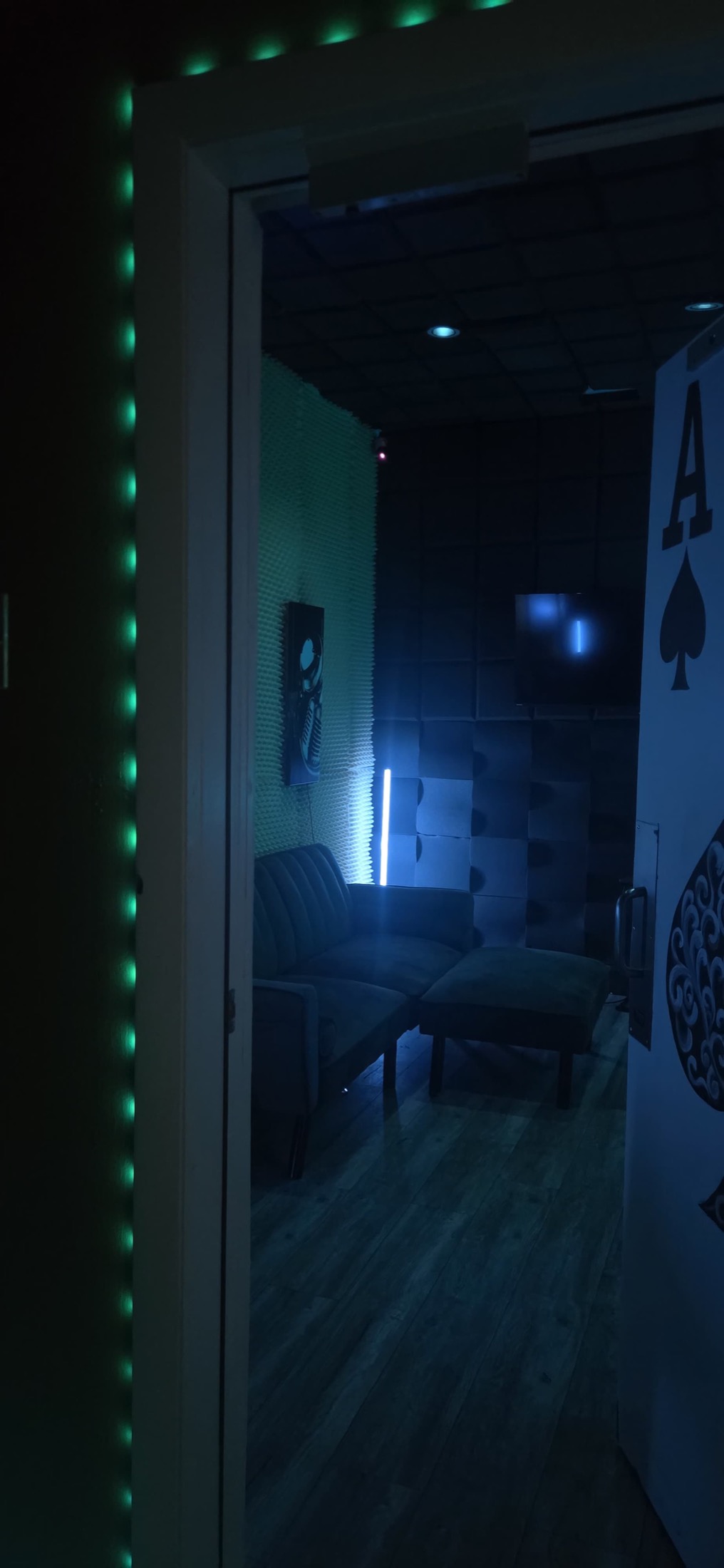 Green-lit A Room booth doorway inside Peace King Studios